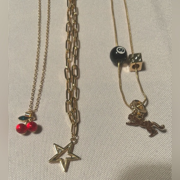 Gold-Tone Layered Charm Necklace Set with Star, Cherry, and 8-Ball Accents - Picture 4 of 4